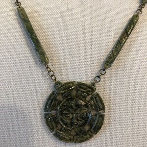 Jade necklace with carved sun